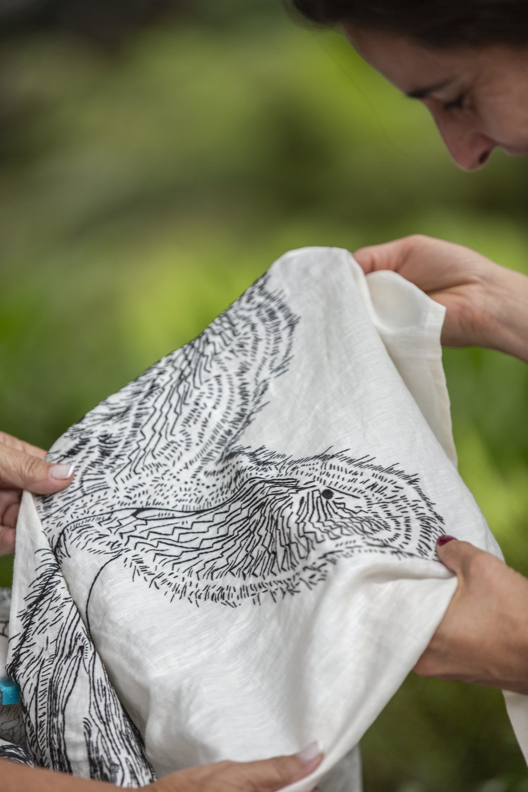 Close study of a dense stitched pattern on linen