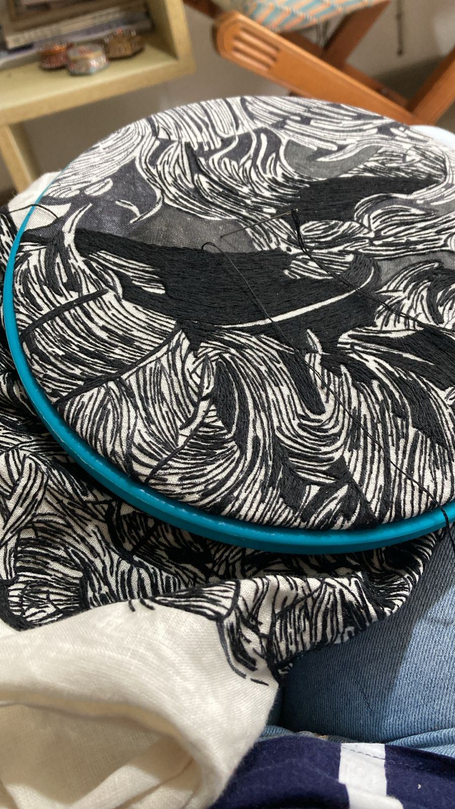 Hoop mid-stitch, navy on black-and-white embroidered linen