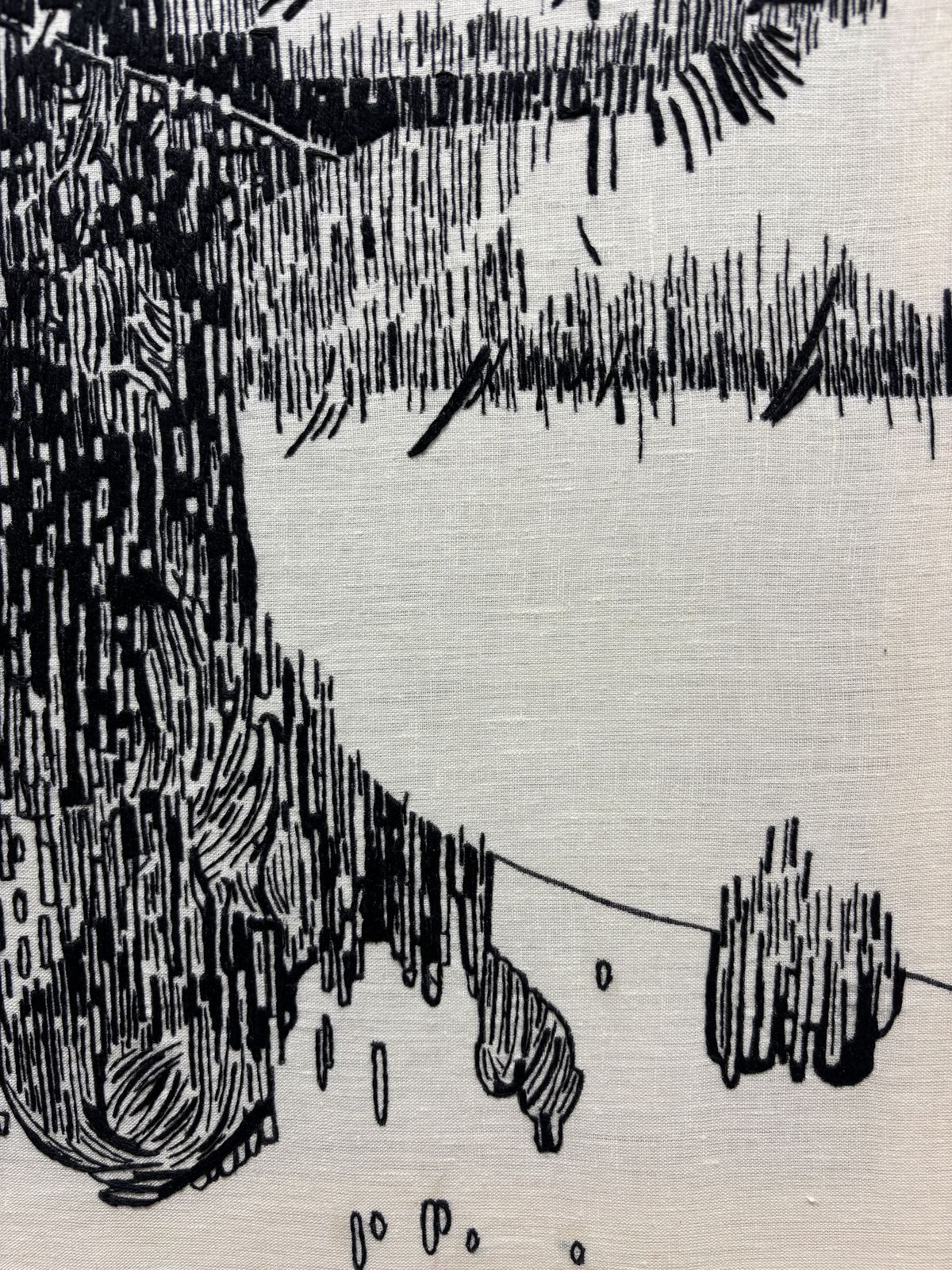 Close detail of black-thread stitching, dense vertical hatching
